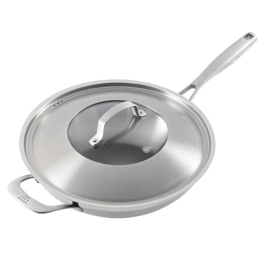 Person serving gourmet pasta from a black bowl - Baccarat id3 stainless steel chef pan with lid 32cm