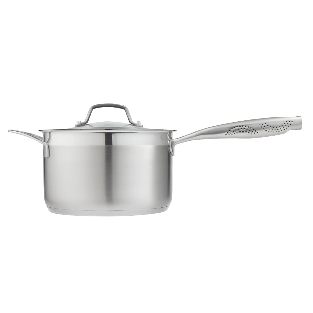 stainless steel saucepan 20cm pot of soup on a wooden board beside black bowl of noodles  - Baccarat