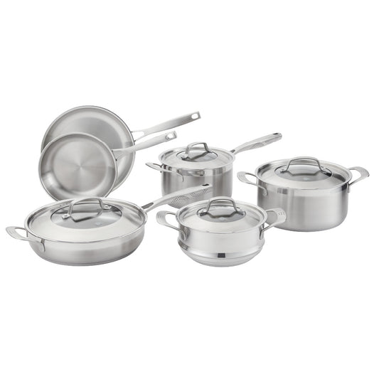 Five stainless steel cookware pieces with vegetables on a kitchen counter 24cm stockpot - Baccarat