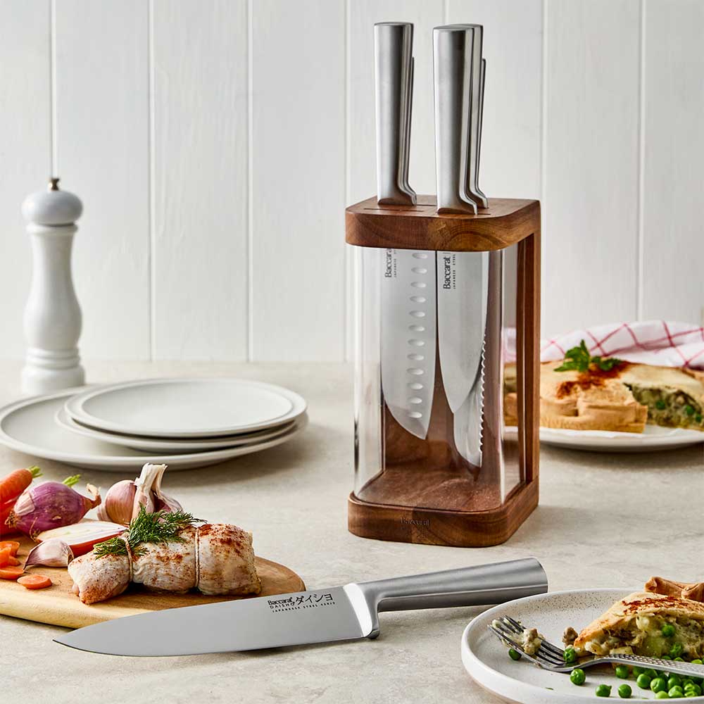 clear panel knife block displayed with pie, roast, and vegetables
