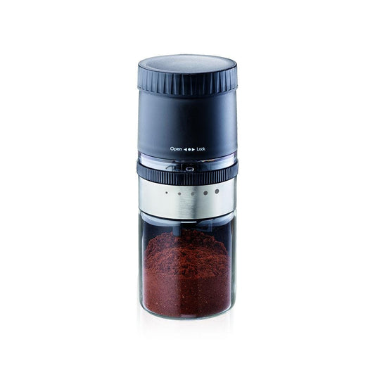 Elegant manual coffee grinder with a sleek transparent base filled with ground coffee - Baccarat