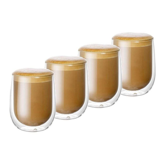 Dalgona coffee in double wall glass with empty glasses and sugar cubes - Baccarat Barista Cafe