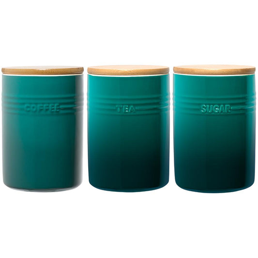 A stylish set of three cylindrical teal ceramic canisters with wooden lids - Baccarat
