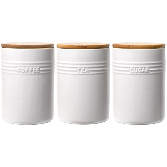 A set of three white ceramic canisters with elegant lids and a sleek design - Baccarat