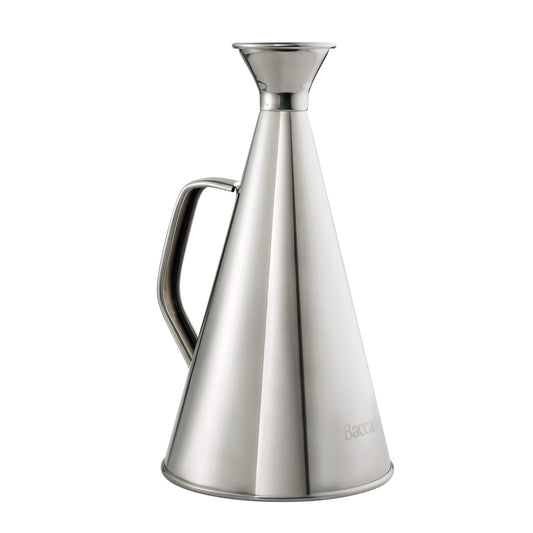 A polished stainless steel oil bottle elegantly drizzling golden olive oil - Baccarat spice market