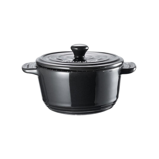 a deliciously baked chicken pie in a mini casserole vibrant purple background - Baccarat stone