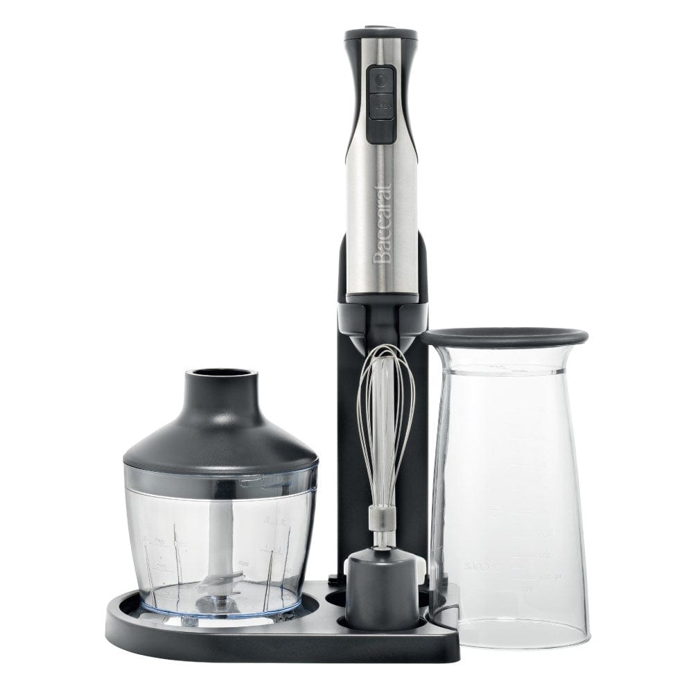 A yellow smoothie is blended surrounded by fresh fruits with a Baccarat The Quick Mix Stick Blender