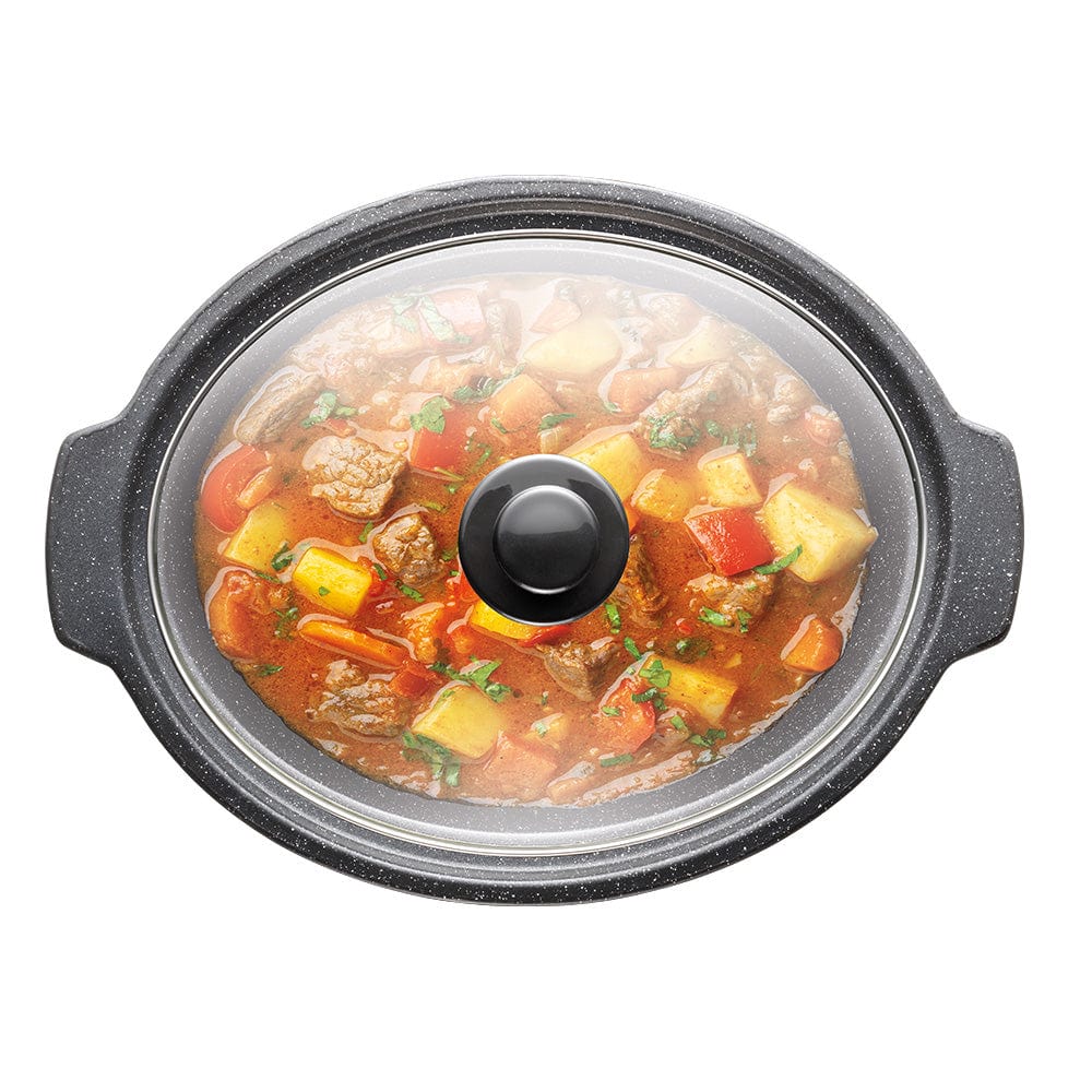 A vibrant orange creamy soup garnished with fresh parsley in a sleek bowl - Baccarat the Tasty Chef